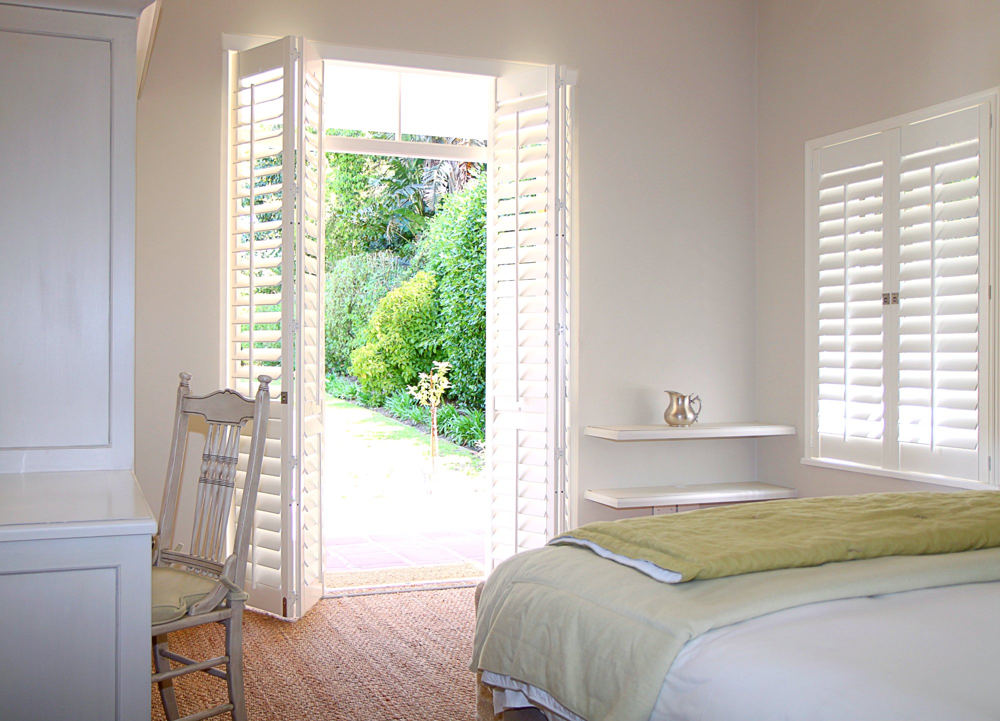 Woodlore shutters providing light control – Las Vegas bedroom